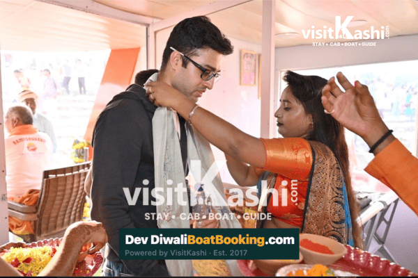 A guest receiving a traditional welcome aboard the boat